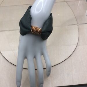 Soft leather bow shaped bracelet.